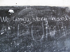 School blackboard with inscription: We learn very hard